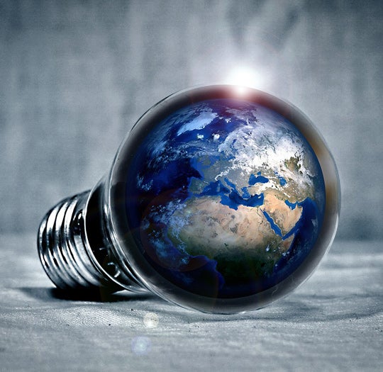 Globe in illuminated lightbulb