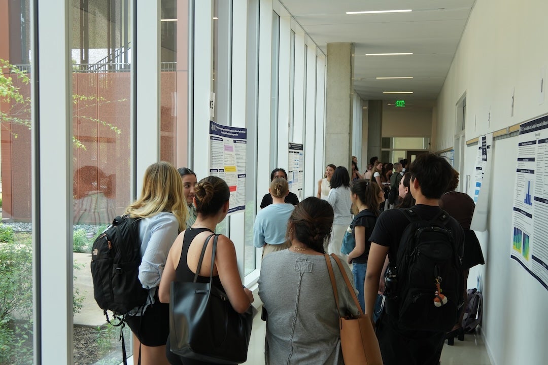 Rice undergraduate students gather in the halls of Kraft Hall to present and discuss research during the Social Sciences Undergraduate Research and Creative Symposium.