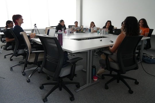 Students in Rice University’s inaugural Making an Exoneree course gather during a class session as they present findings from semester-long investigations into potential wrongful conviction cases.