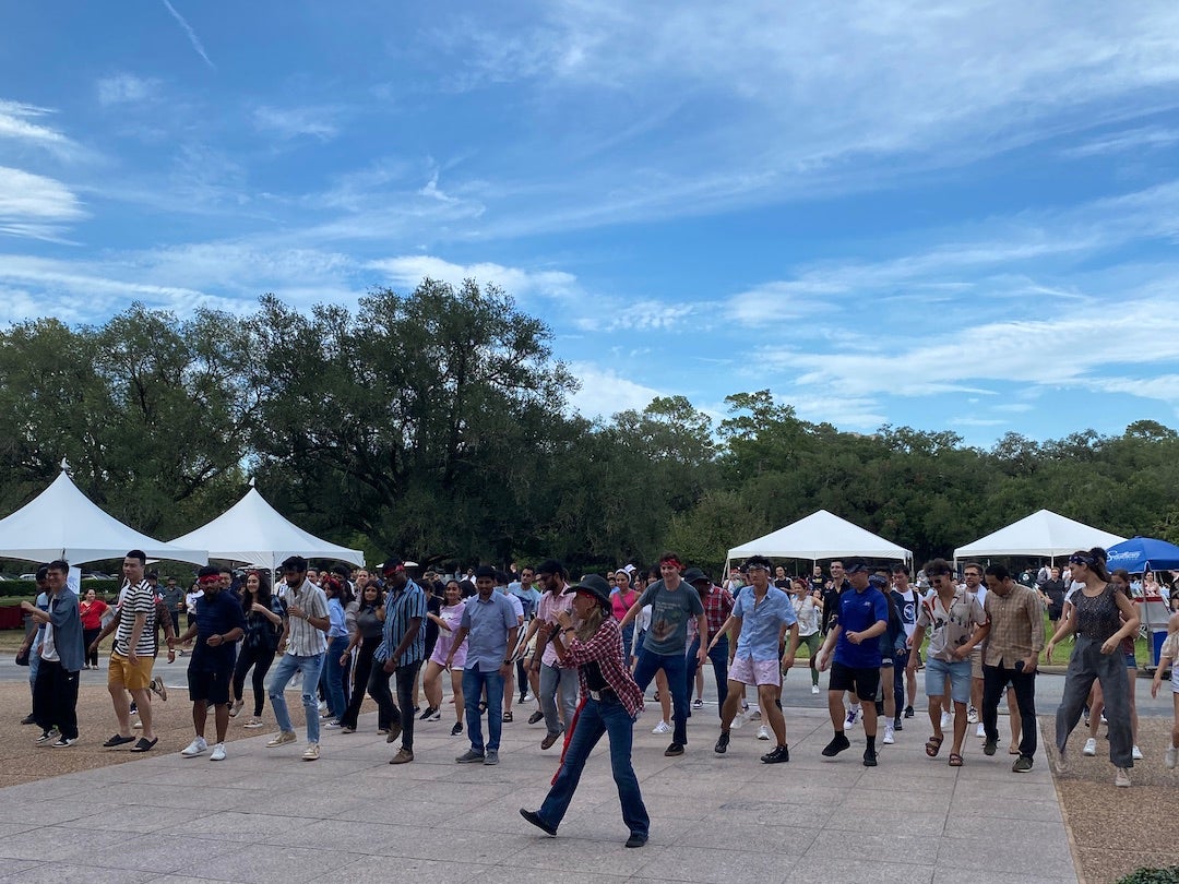 International graduate students learning how to line-dance