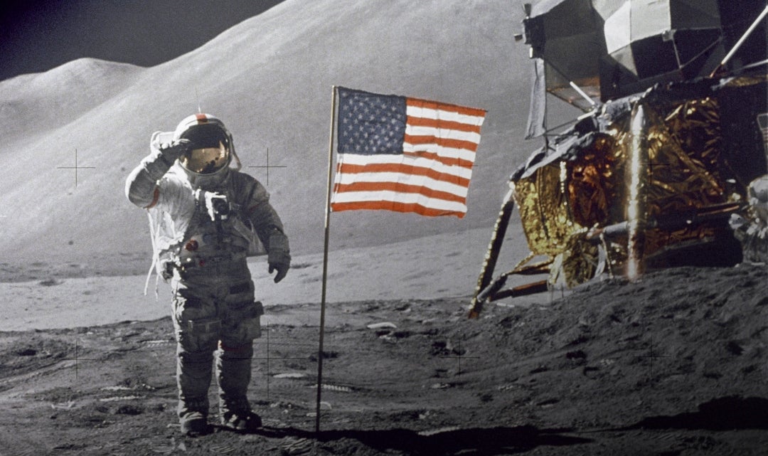 An astronaut lands on the moon.