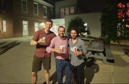From left to right, Ezra Clark, Thomas Senftle and Marc Porosoff at the conference where the idea for PodCAT was hatched