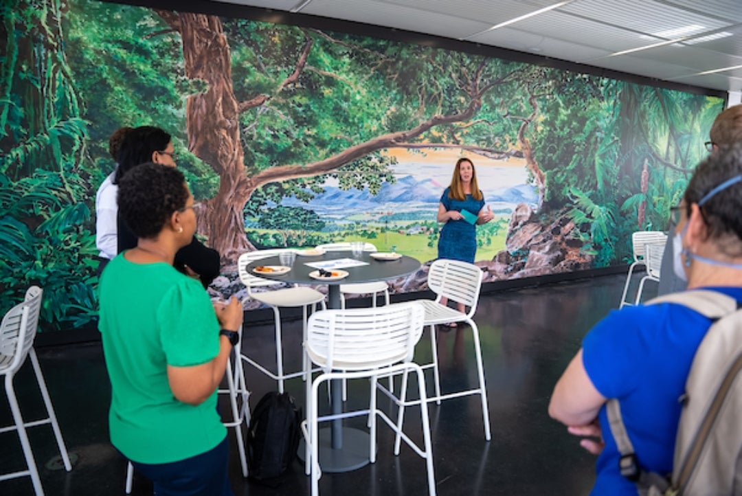 Woman addressing a group of people