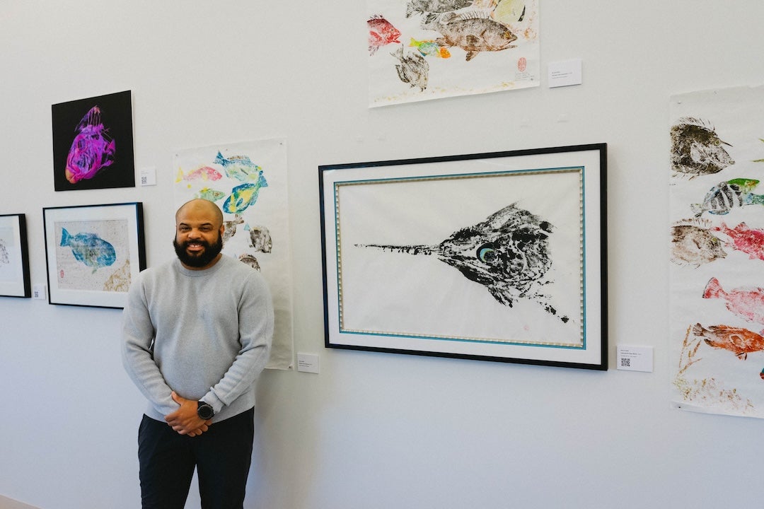 Kory Evans in front of exhibit