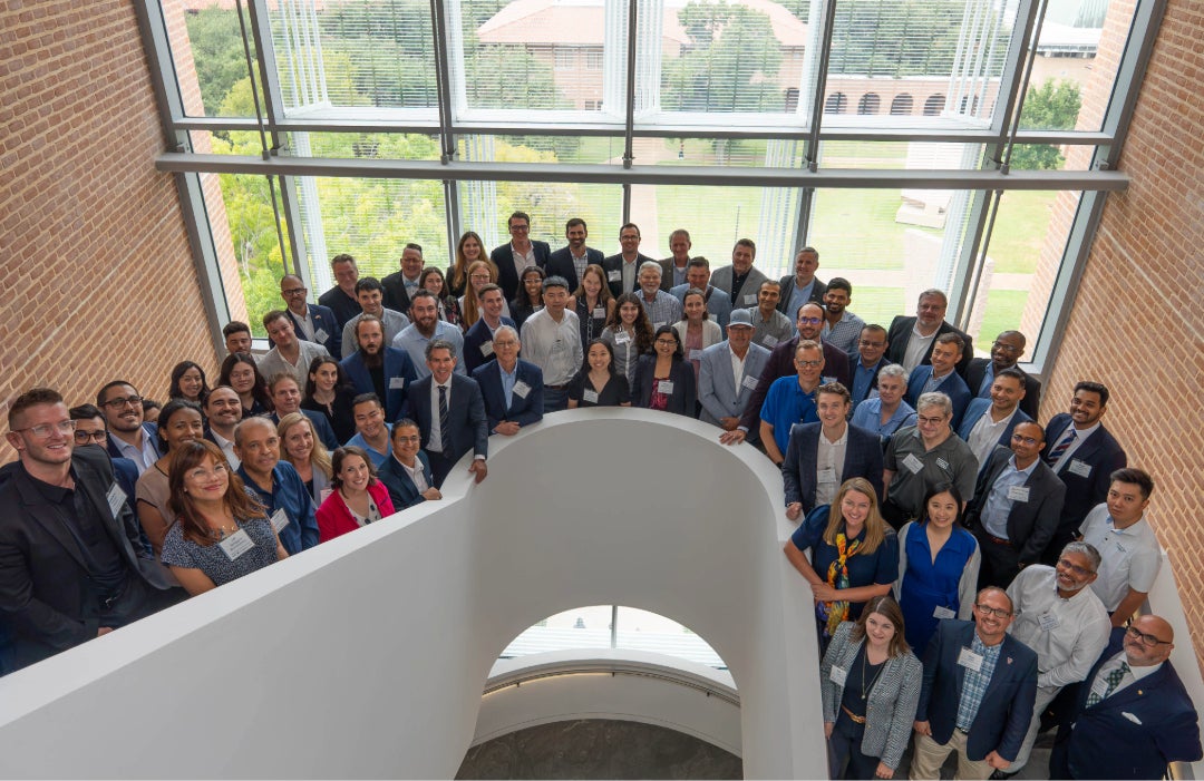 conference attendees gather for a group photo