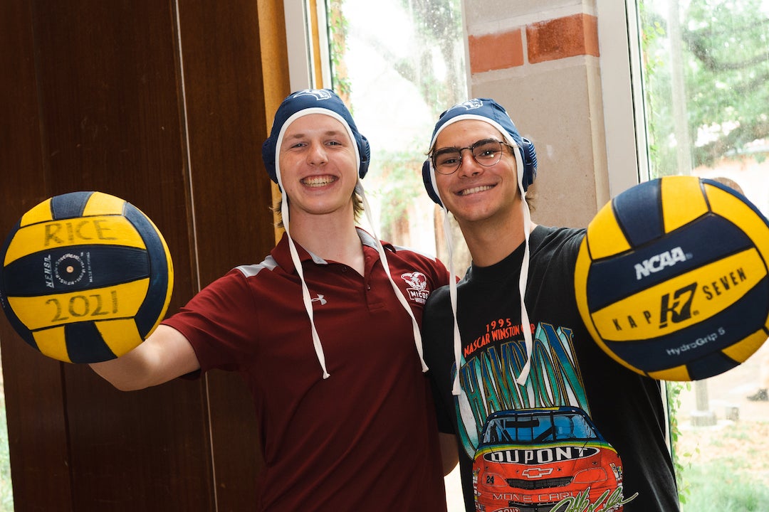 Two Rice water polo team members at Student Activities Fair