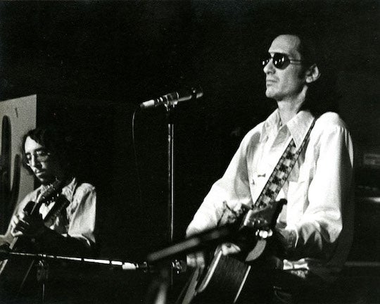 Mickey White (left) and Townes Van Zandt (right) perform during a gig.