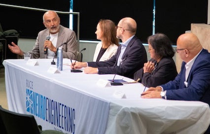 panelists seated at table 