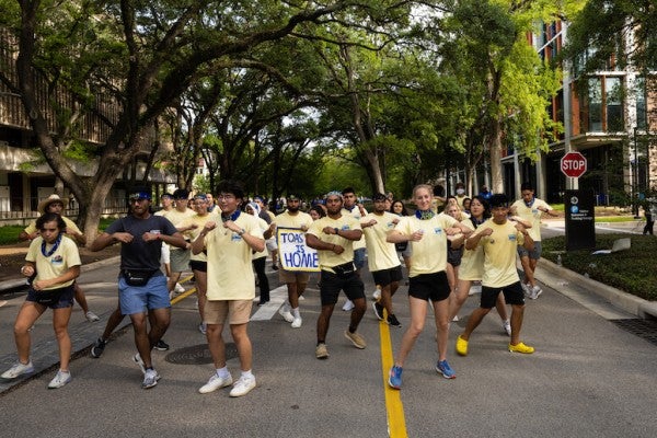 Lovett College O-Week advisors dancing in the street