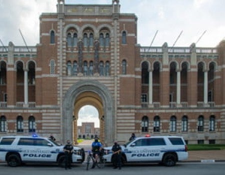 RUPD officers standing in front of Lovette Hall 