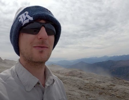 Rice Ph.D. student Patrick Phelps atop Chile's Cordon Caulle volcano in March 2022