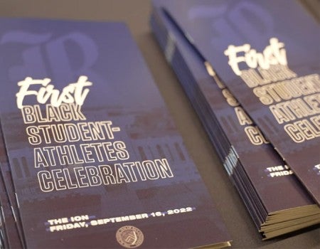 Programs for Rice's First Black Student-Athletes Celebration are pictured sitting on a table.