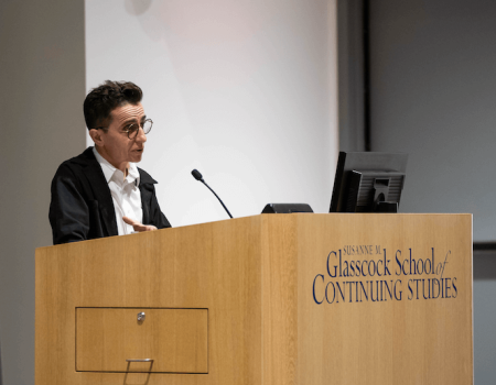 Masha Gessen speaking at podium