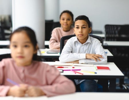 Photo of English language learner in class.