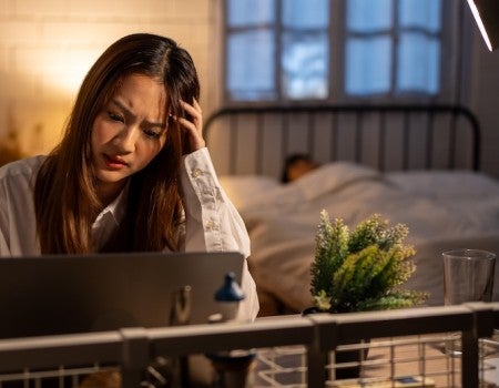 Stressed woman at bedtime. 