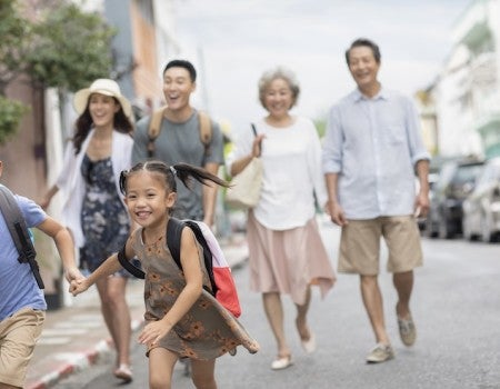 Happy family on street. 