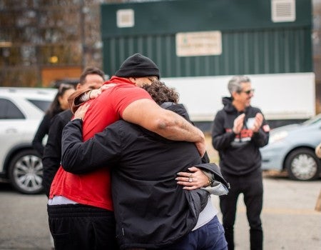 Gary Benloss celebrates with supporters after his release from prison following 26 years of incarceration. The Making an Exoneree program contributed to advocacy efforts surrounding his case.