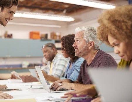 Adult learners participate in a classroom discussion, a focus of research by Rice University professor Margaret Beier.