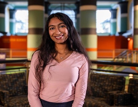 female student smiling at the camera