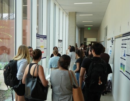 Rice undergraduate students gather in the halls of Kraft Hall to present and discuss research during the Social Sciences Undergraduate Research and Symposium.