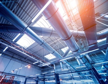 A stock image of an air conditioning system in an industrial building