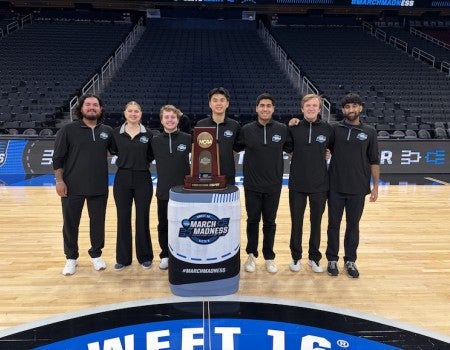 Rice University sport management students pose with the South Regional trophy at Toyota Center, where they worked as court attendants during the Sweet 16 and Elite 8. Photo courtesy of Jacob Lozano