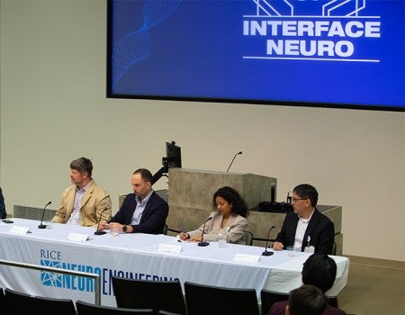 panelists seated at confrence table