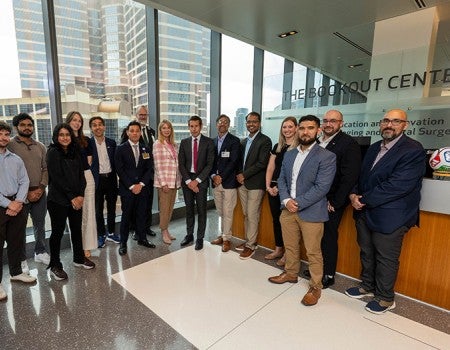 group of people facing the camera in a lobby area