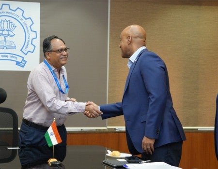 Reginald DesRoches shaking hands with IIT Bombay leader