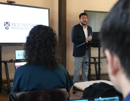 Rodrigo Ferreira speaking at the Human Flourishing in the Age of AI conference