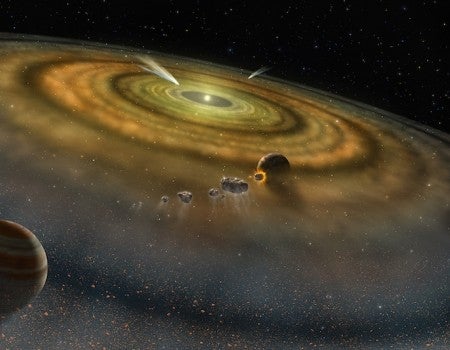 bird's eye view of the developing solar system, with dust in circles around the sun.