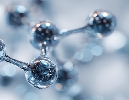 A molecule is rendered in silver. 