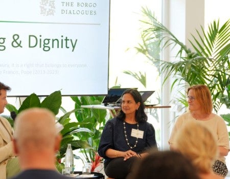 Amy Dittmar seated for a panel discussion with two other experts