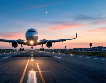 stock photo of a plane landing on a runway