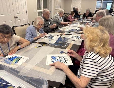 A group of Belmont residents attend a painting course as part of Rice University's Lifelong University program.