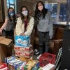 Students standing with snacks