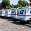 Postal Trucks parked next to each other