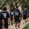 Students walking with Black Lives Matter shirts on Rice's campus