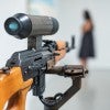 "America's Finest" by Lynn Hershman Leeson is an interactive installation with video camera and AK-47. (Photos by Jeff Fitlow)