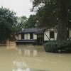 Home partially submerged in flood water