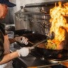 Andy Tat fires up lunch at Wok on Sunset in the North Servery. (Photos by Tommy LaVergne)