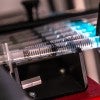 Rice University bioscientists have developed a microfluidic platform for high-throughput studies of how bacteria evolve antibiotic resistance. One syringe of a solution containing bacteria or an antibiotic can provide millions of microspheres for analysis. 