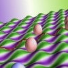A theory by Rice University researchers suggests growing graphene on a surface that undulates like an egg crate would stress it enough to create a minute electromagnetic field. The phenomenon could be useful for creating 2D electron optics or valleytronics devices. (Credit: Illustration by Henry Yu/Rice University)