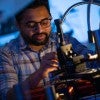 Rice postdoctoral fellow Kedar Joshi prepares an experiment at the Biswal Lab to see how magnetic fields will affect a colloid of magnetic particles.