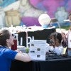 Girls at a booth at STEM fair