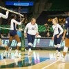 Rice volleyball player Carly Graham exults while surrounded by teammates on the court during the Owls' victory over Colorado in the first round of the NCAA Tournament Thursday in Waco, Texas.