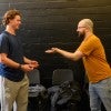 Student on left participating in acting exercise with professional actor on right