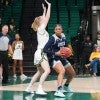 A Rice women's basketball player looks to shoot during a conference game against the University of Alabama at Birmingham.