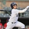 Rice baseball player Manny Garza looks to run for first base after making contact with a pitch.