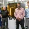 From left, Andrew Cooper and Rick Jennings of TyRex Group join Rice's Paul Cherukuri and Grant Belton for a photo with Rice's L1 3D printer, which is located at TyRex's manufacturing plant in Austin, Texas